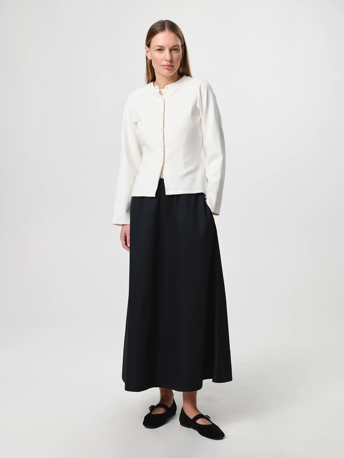 Julie Josephine Alba Top White Carla Cardigan: heavy rib cotton top in white with a clean minimal silhouette, designed as an everyday essential in a structured ribbed jersey that holds its shape, easy to style on its own or layered under shirts, blazers, and knitwear.