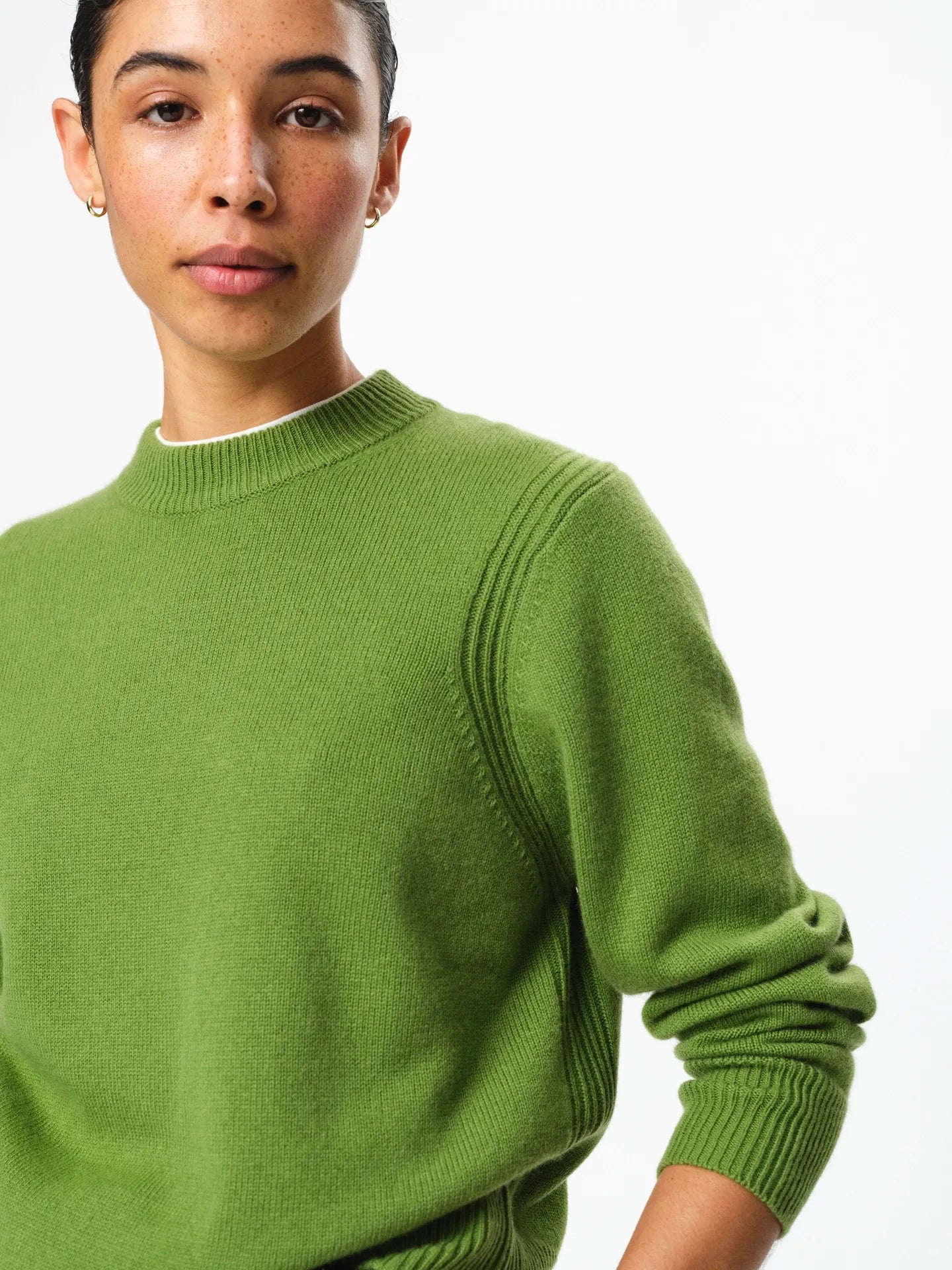 Julie Josephine Alma Sweater Tulip Green: soft breathable knit sweater in a tulip green shade made in a 90% wool and 10% cashmere blend, designed with a clean crew neckline, subtle relaxed shoulders, long sleeves, and a flattering regular fit with gentle structure, a refined everyday essential that looks simple, comfortable, and elevated.