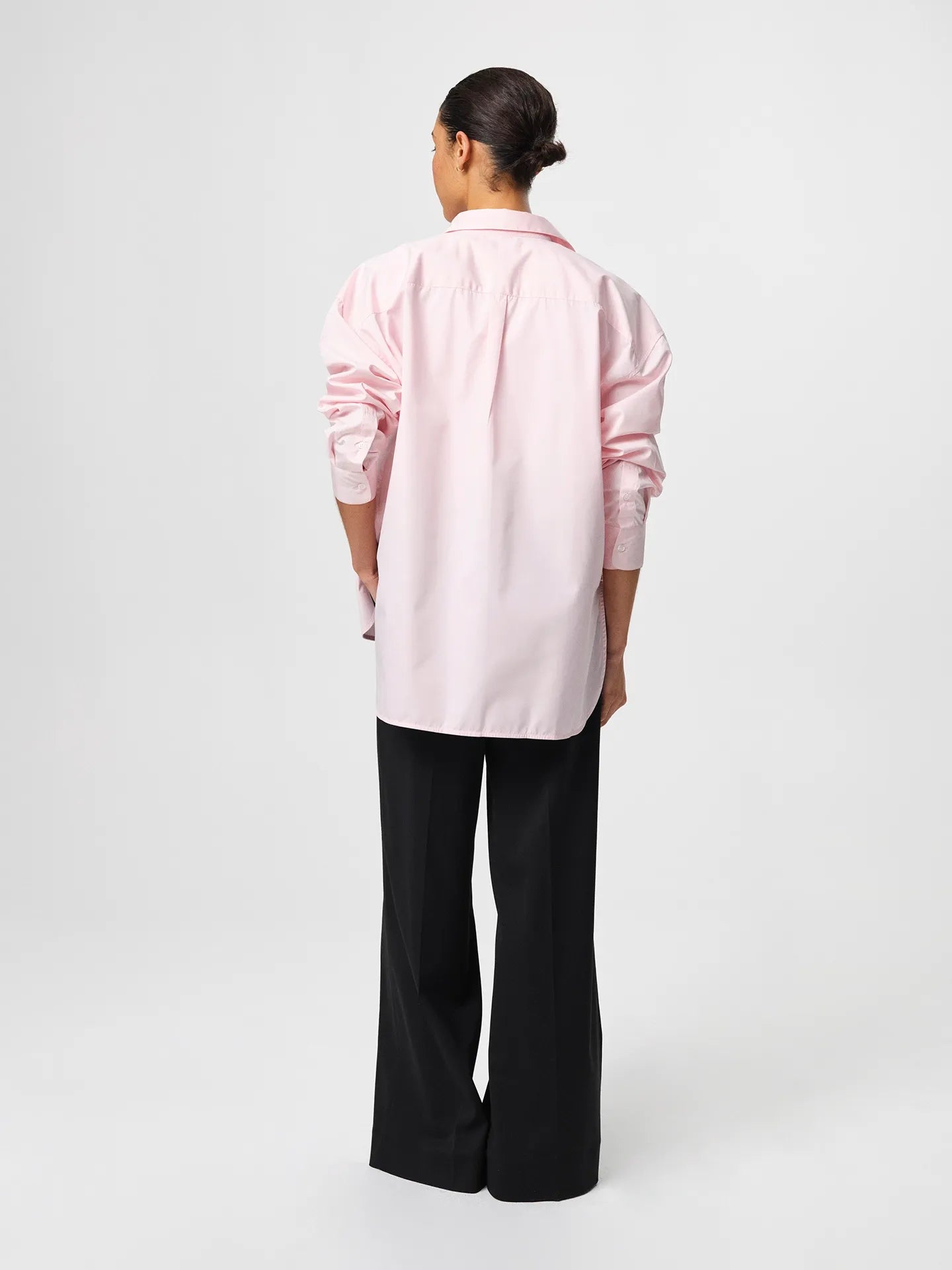 Julie Josephine Edwina Shirt Peony Pink: oversized tailored shirt in peony pink made from crisp 100% cotton poplin, designed with a sharp collar, dropped shoulders, and a gently curved hem for a fresh modern silhouette, an everyday wardrobe essential styled for effortless pairing with tailored trousers or layered over a fitted top.