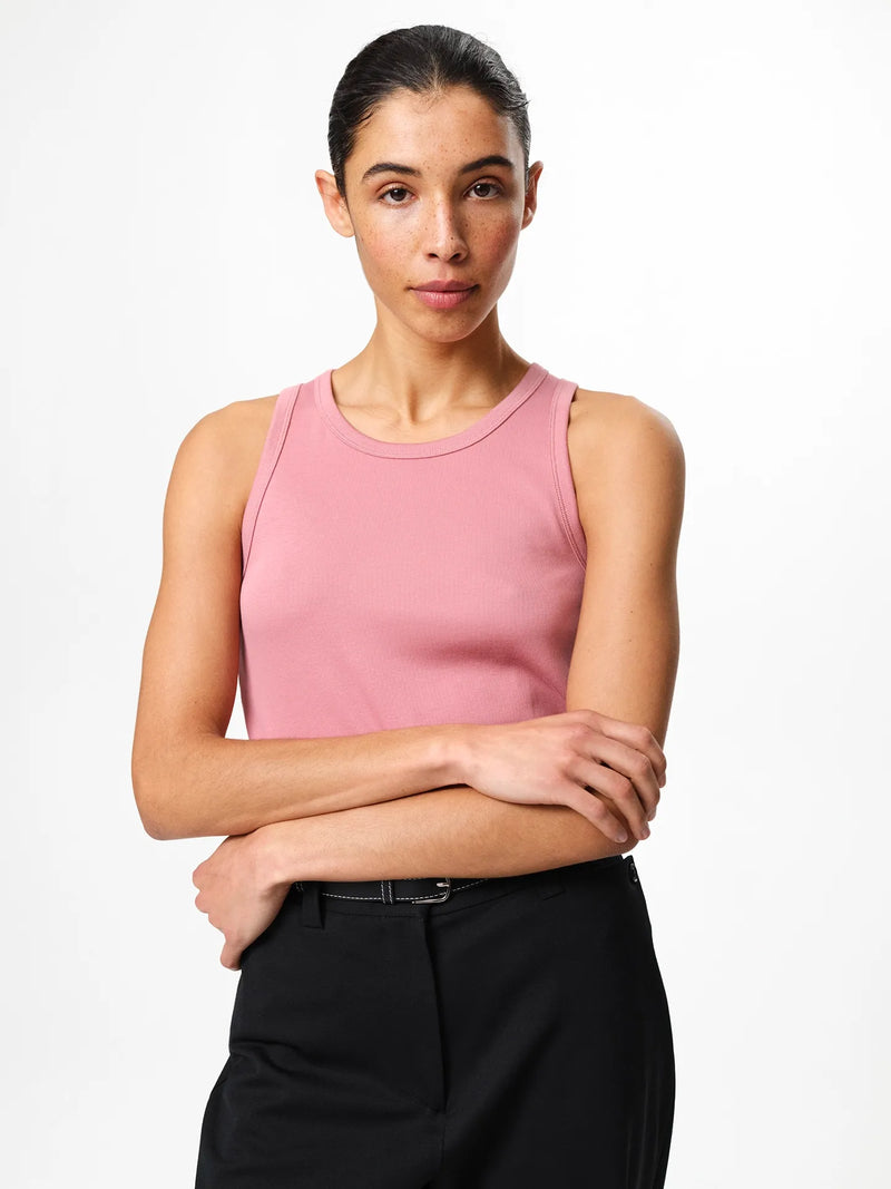 Julie Josephine Ella Rib Top Rosy Pink: slim fit ribbed top in rosy pink made from a 94% Italian pima cotton and 6% polyamid blend, crafted in signature cotton blend rib jersey with a smooth stretchy feel, designed as a versatile wardrobe essential to wear on its own or as an easy layering piece under shirts, knits, and blazers.