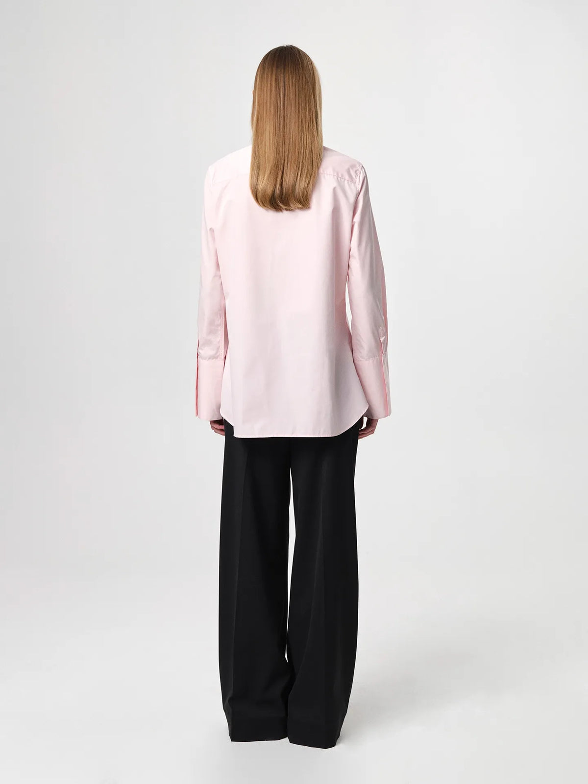 Julie Josephine Julie Shirt Peony Pink: iconic bestselling cotton twill shirt in peony pink made from crisp 100% cotton, tailored with a fitted shoulder and clean straight body for a polished silhouette, finished with elongated statement cuffs and a modern curved hem, designed to wear untucked or layered under a favorite knit with the cuffs showing, crafted in Portugal as a timeless wardrobe staple made to be worn, loved, and kept for years.
