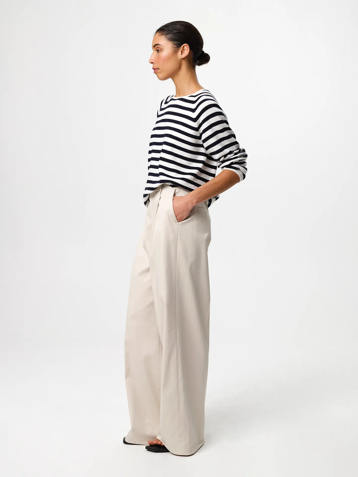 Julie Josephine Kate Roundneck Sweater Navy Stripe: product photo of a refined everyday knit in a navy and off white stripe pattern, made from a soft wool and cotton blend that balances natural warmth with breathable lightness, featuring a relaxed silhouette with subtle dropped shoulders and a clean V neckline, styled for effortless layering over a T shirt or worn on its own with tailored trousers or denim.