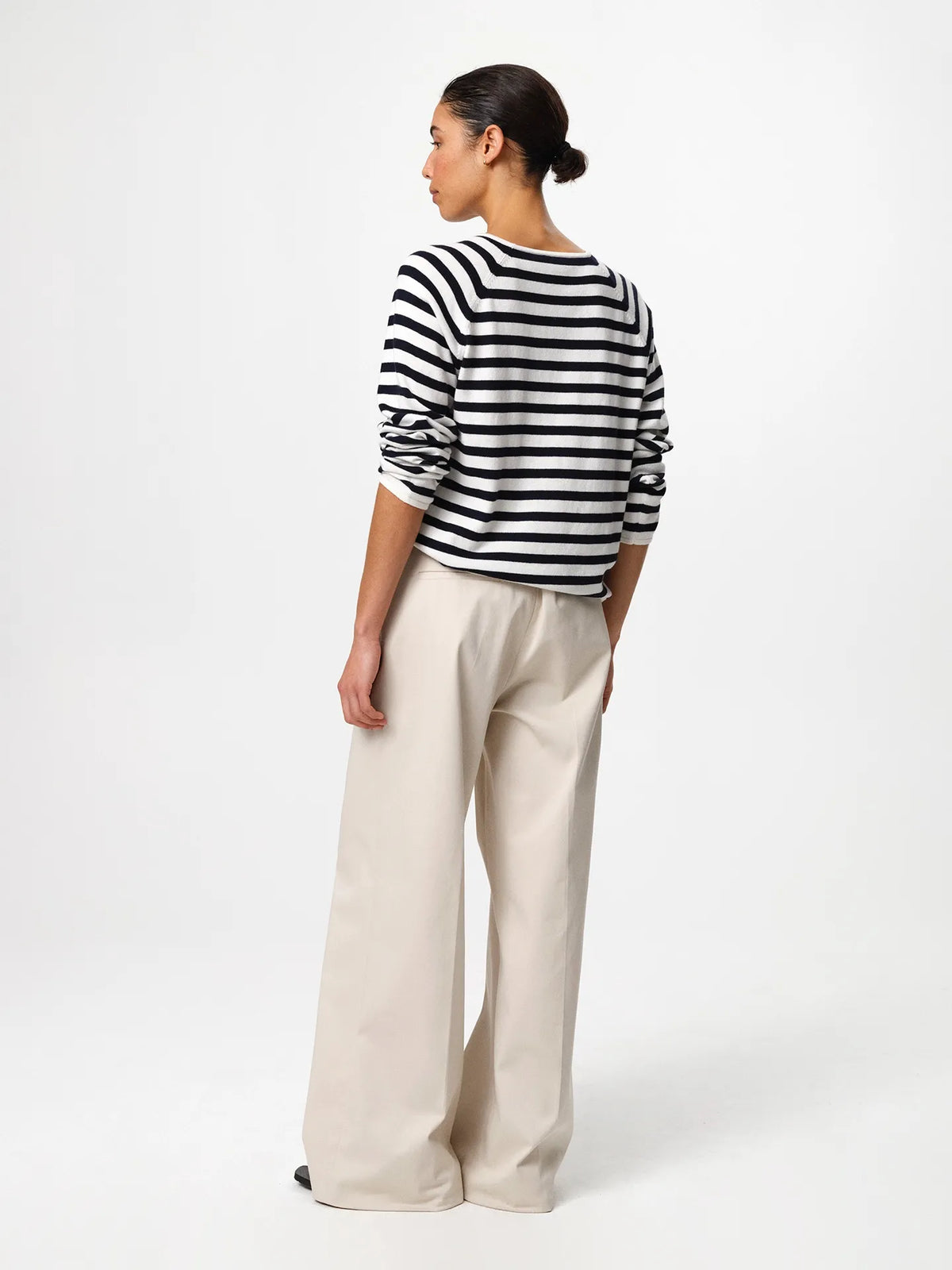 Julie Josephine Kate Roundneck Sweater Navy Stripe: product photo of a refined everyday knit in a navy and off white stripe pattern, made from a soft wool and cotton blend that balances natural warmth with breathable lightness, featuring a relaxed silhouette with subtle dropped shoulders and a clean V neckline, styled for effortless layering over a T shirt or worn on its own with tailored trousers or denim.