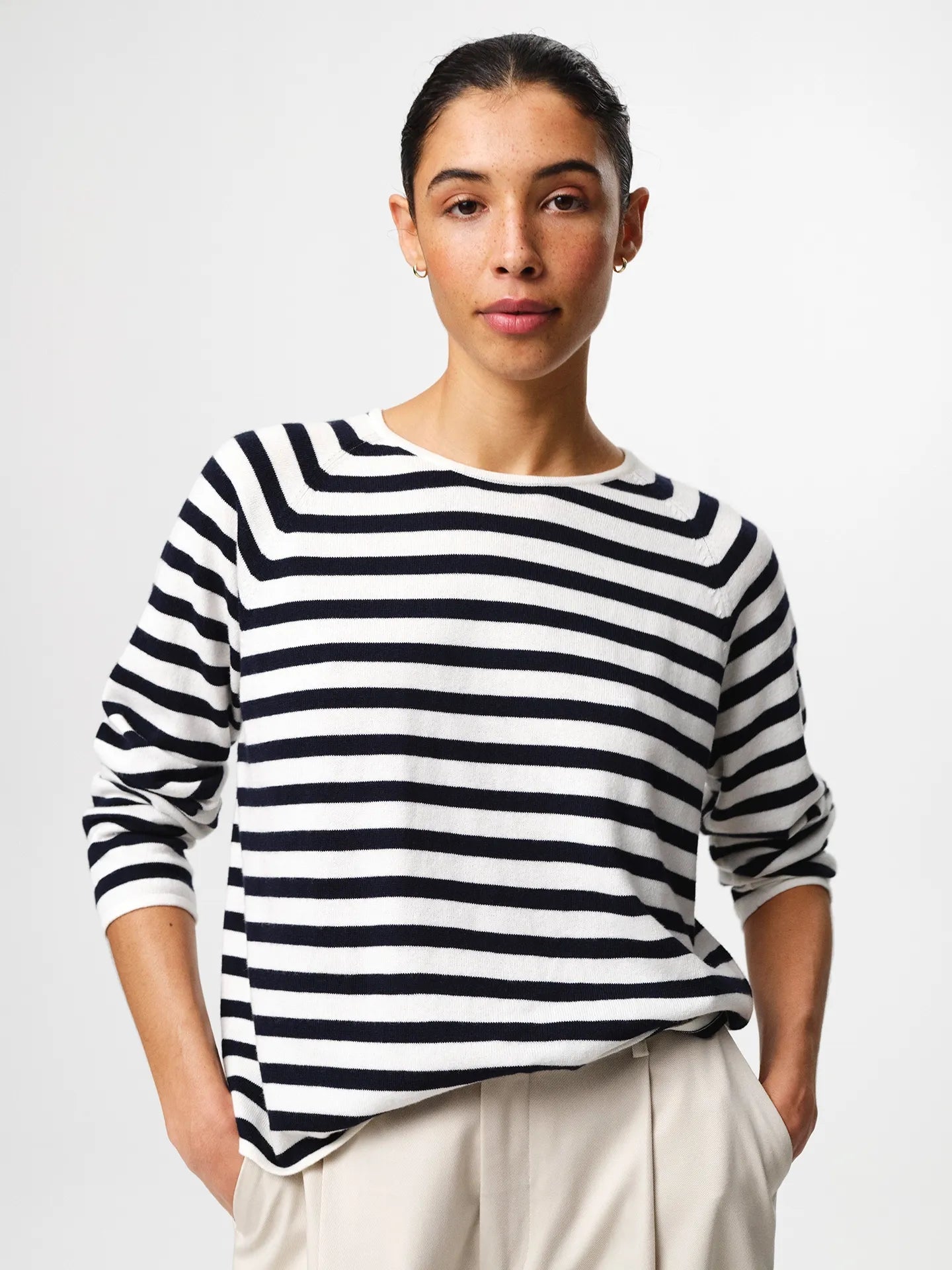 Julie Josephine Kate Roundneck Sweater Navy Stripe: product photo of a refined everyday knit in a navy and off white stripe pattern, made from a soft wool and cotton blend that balances natural warmth with breathable lightness, featuring a relaxed silhouette with subtle dropped shoulders and a clean V neckline, styled for effortless layering over a T shirt or worn on its own with tailored trousers or denim.