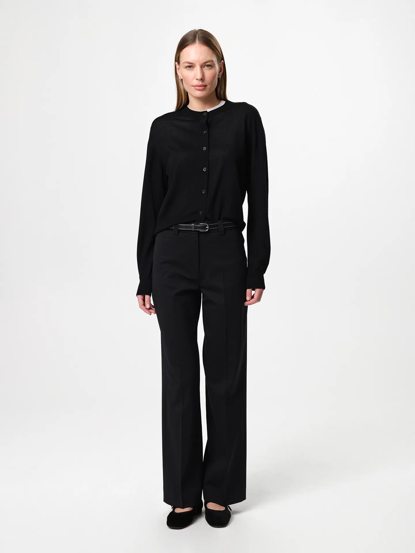 Lilja Merino Cardigan in black, crafted from 100% fine merino wool with a regular fit, round neckline, ribbed hem and lightweight knit quality designed for layering.