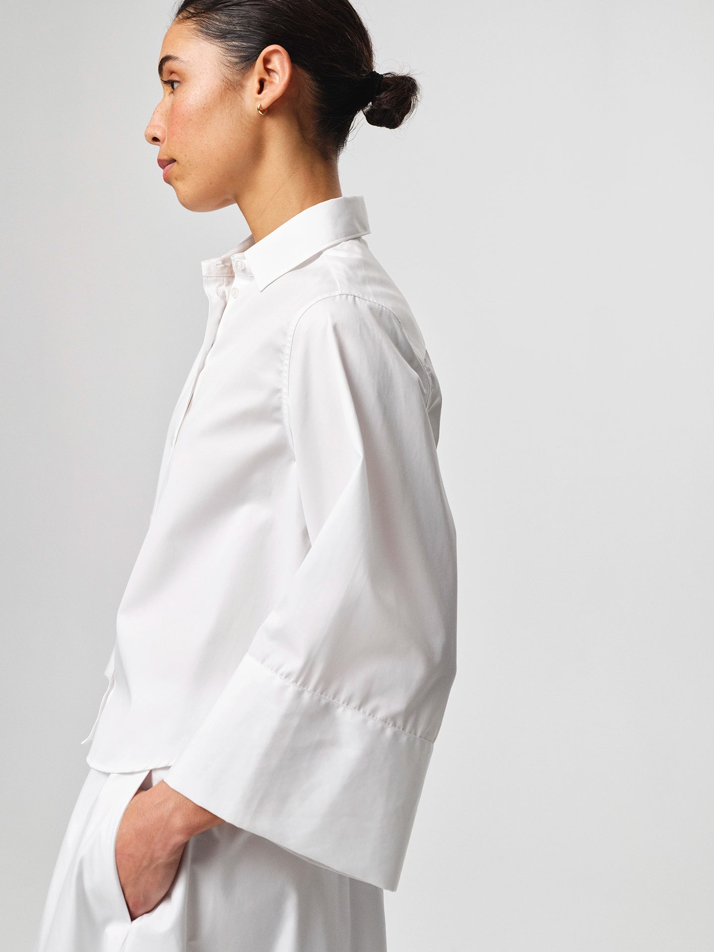 Julie Josephine Anja Shirt White: crisp white shirt made from 100% cotton with a clean classic silhouette, designed as a versatile wardrobe staple that works polished on its own or layered under knitwear and outerwear for effortless everyday styling.