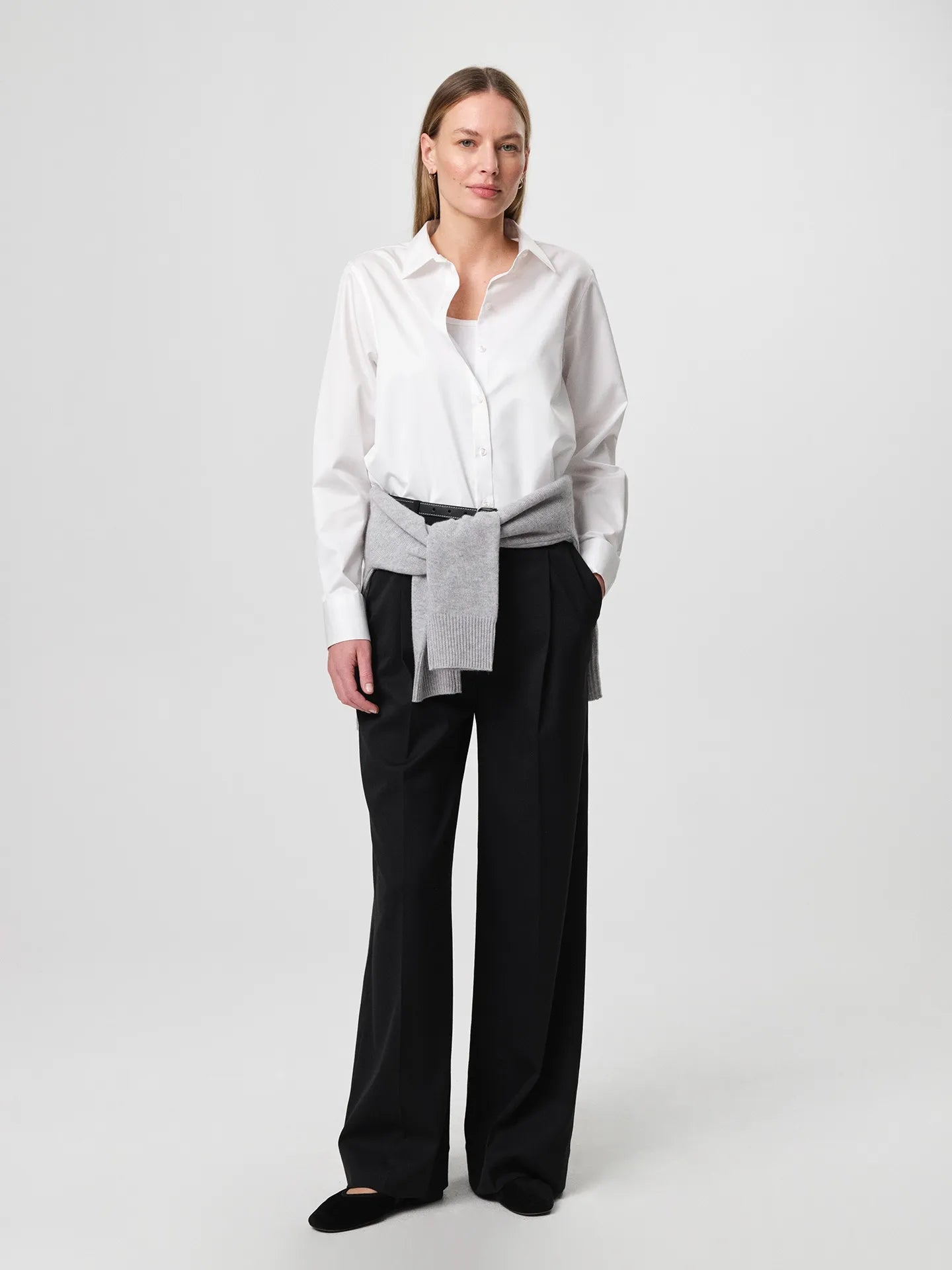 Sofie Shirt in white, made from crisp cotton twill with a soft A-line silhouette and curved hem for a relaxed look.