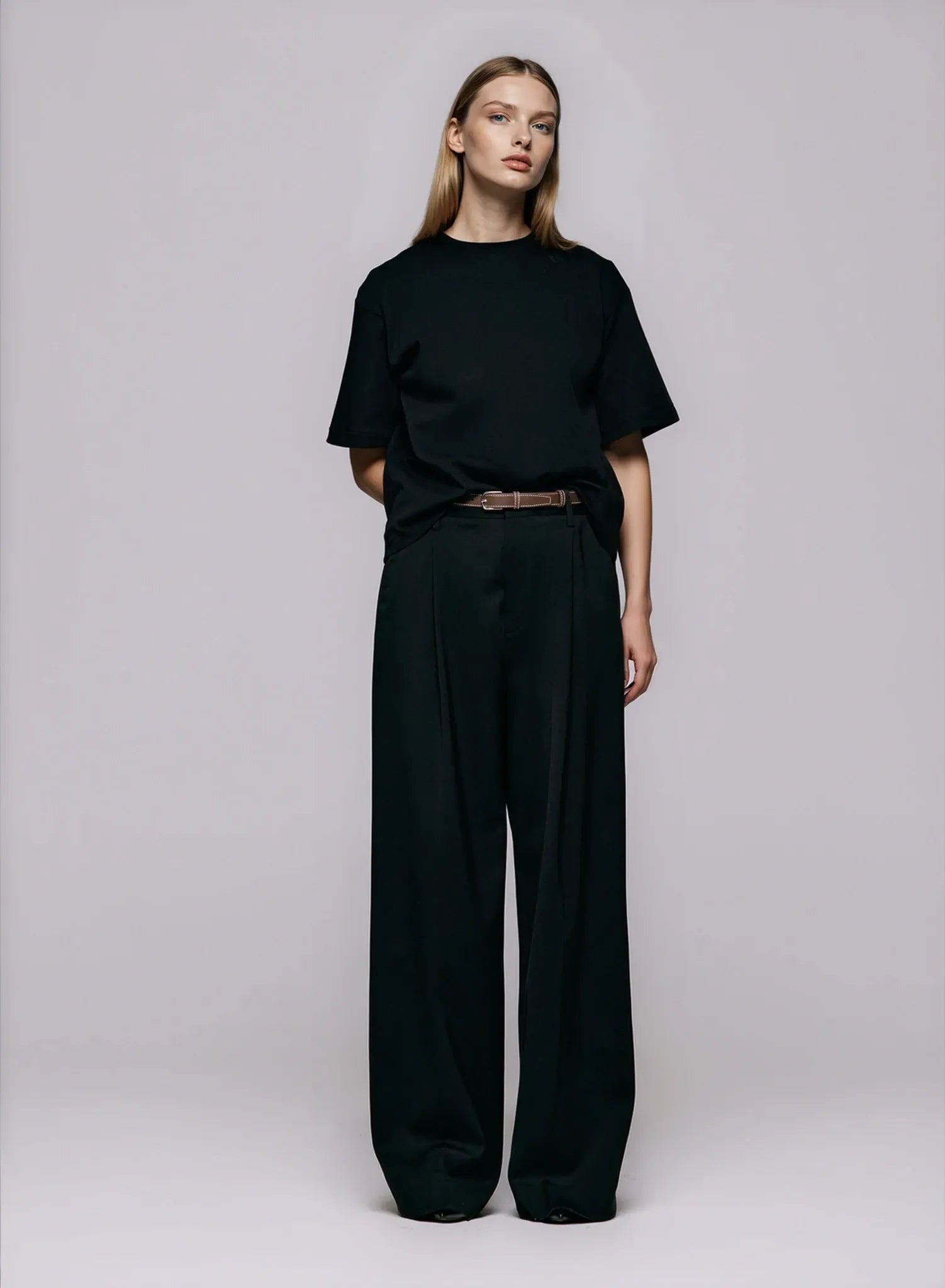 The Stella Tee in black by Julie Josephine, featuring a clean crew neckline, soft cotton texture, and a modern, oversized fit for timeless everyday wear