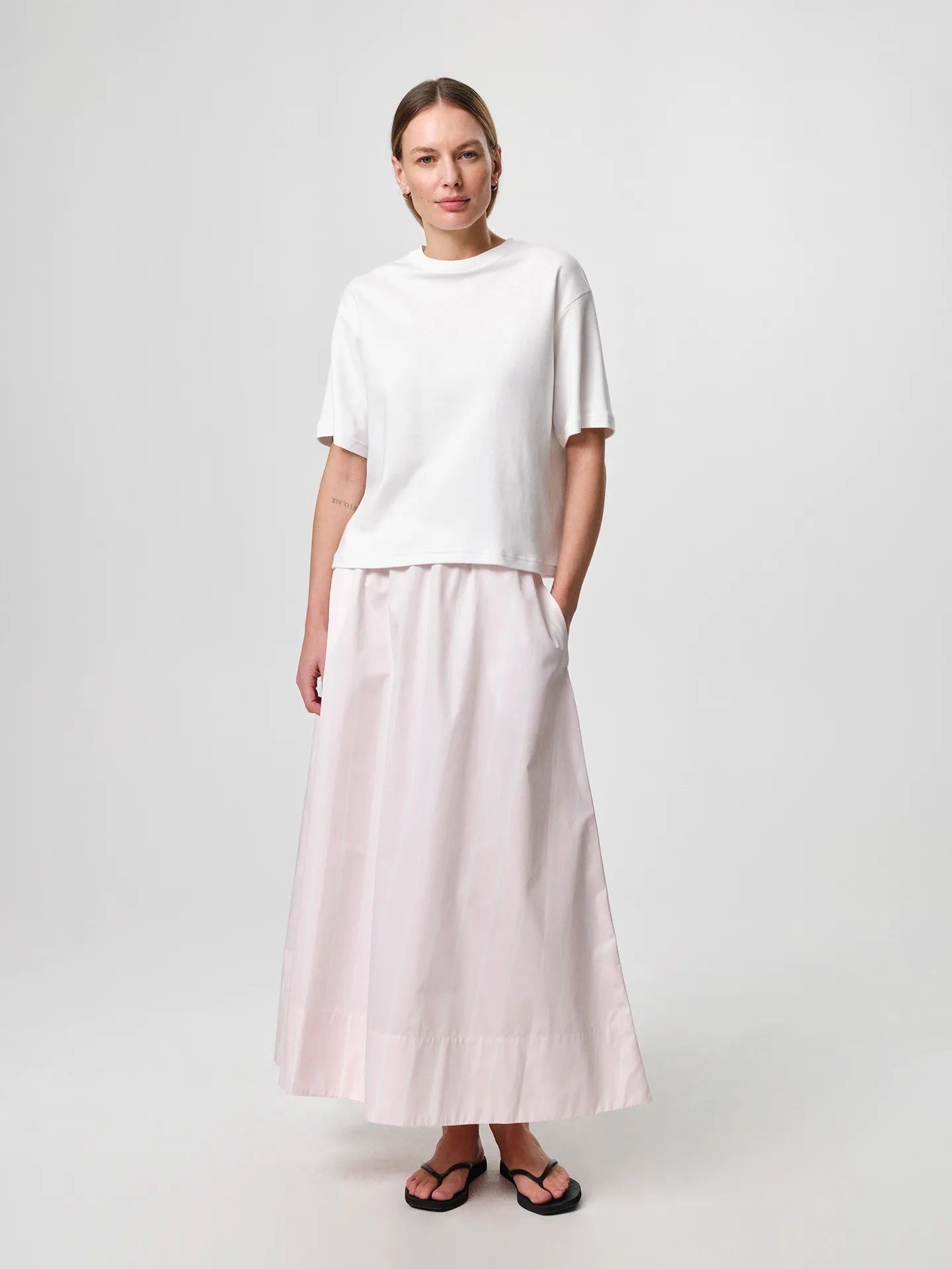 Stella T-shirt in white, crafted from soft organic cotton jersey with a classic crew neckline and relaxed fit.
