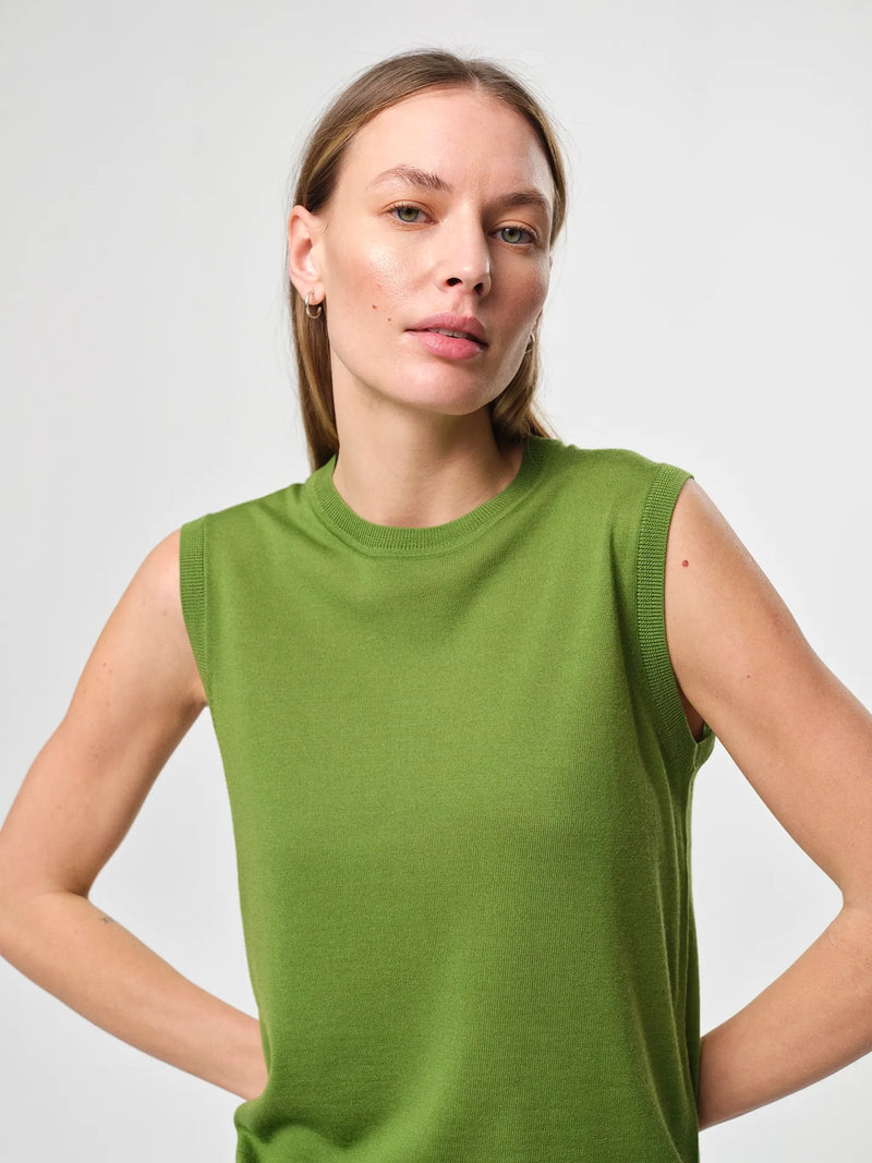 Julie Josephine Tanja Wool Top Tulip Green: product photo of a refined sleeveless knit top in tulip green, made from 100% merino wool with a soft lightweight feel, featuring a clean regular fit and classic crew neckline, designed as a versatile layering piece worn on its own or under knits, blazers, and jackets for year round wear.