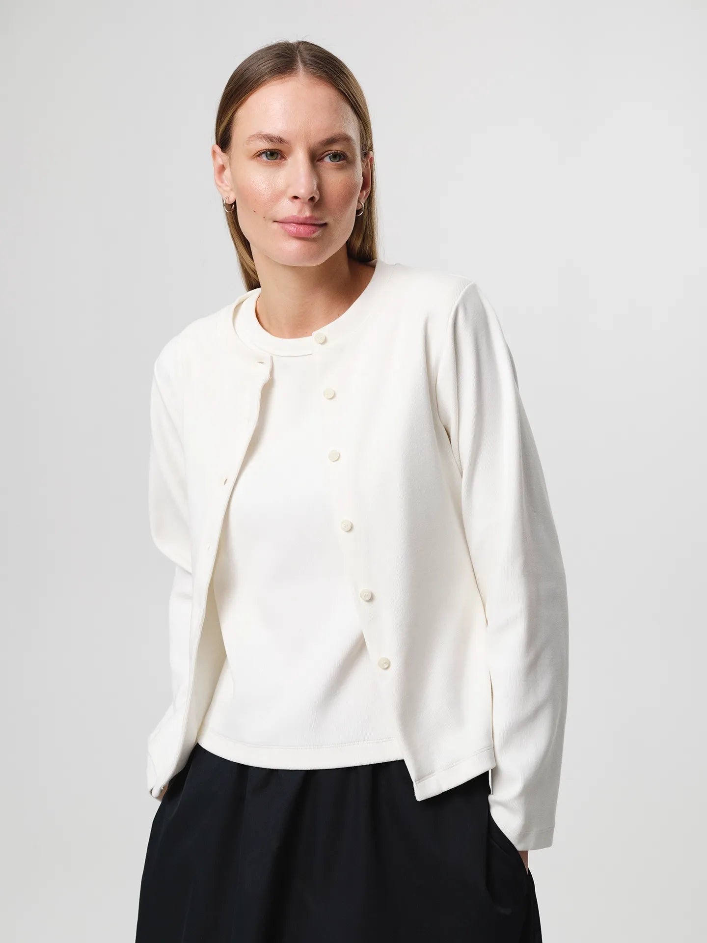 Julie Josephine Alba Top White Carla Cardigan: heavy rib cotton top in white with a clean minimal silhouette, designed as an everyday essential in a structured ribbed jersey that holds its shape, easy to style on its own or layered under shirts, blazers, and knitwear.