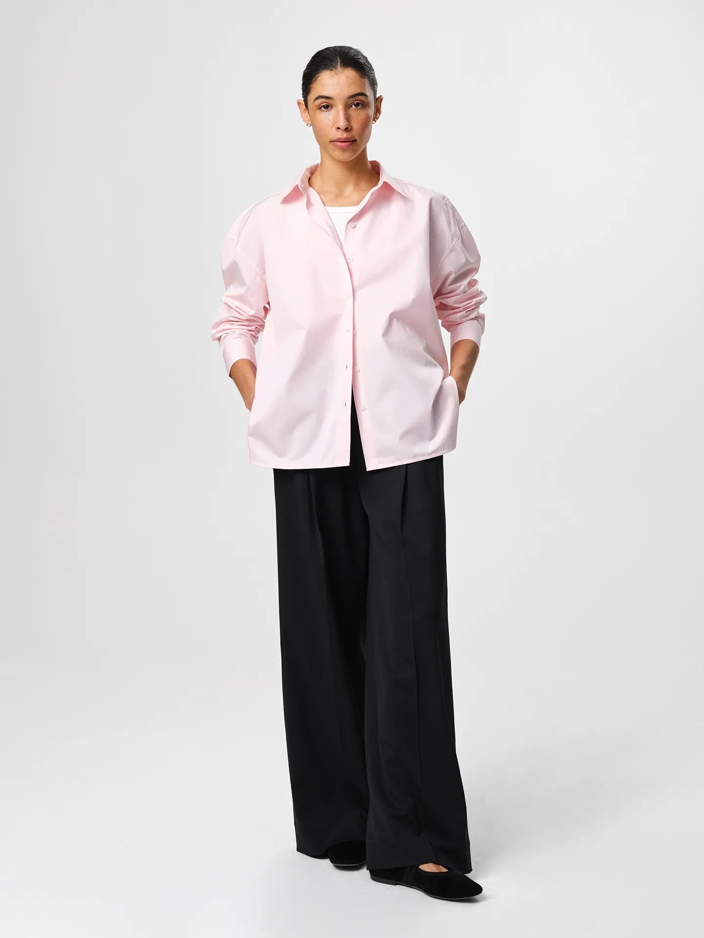 Julie Josephine Edwina Shirt Peony Pink: oversized tailored shirt in peony pink made from crisp 100% cotton poplin, designed with a sharp collar, dropped shoulders, and a gently curved hem for a fresh modern silhouette, an everyday wardrobe essential styled for effortless pairing with tailored trousers or layered over a fitted top.