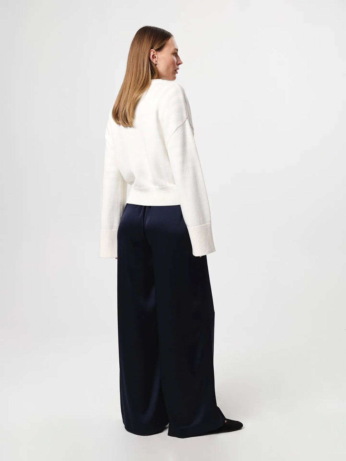 Julie Josephine Henrikke Cardigan: timeless knit cardigan in a 50% wool and 50% cotton blend, designed with a relaxed silhouette and wide loose sleeves, a more fitted waist, ribbed neckline, classic front button fastening, extended loose ribbed cuffs, and a ribbed hem for an understated everyday layering piece.