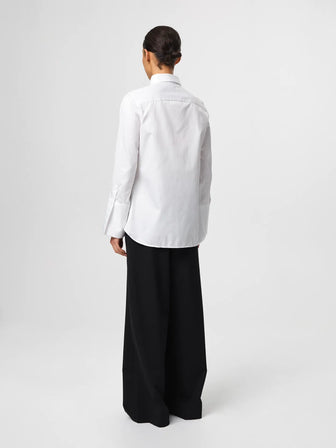 Julie Shirt in white, crafted from crisp cotton twill with a fitted shoulder, clean straight body and elongated cuffs for an elevated silhouette.