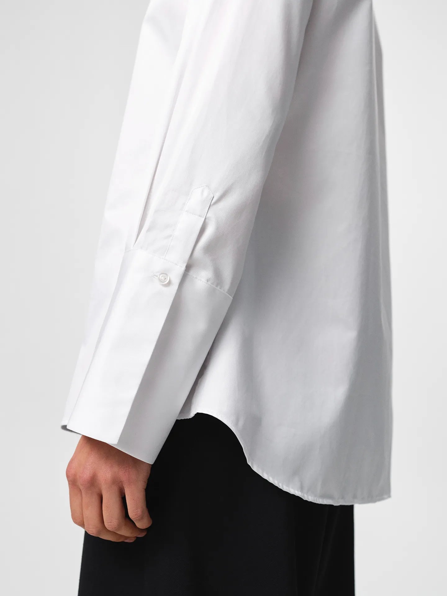 Julie Shirt in white, crafted from crisp cotton twill with a fitted shoulder, clean straight body and elongated cuffs for an elevated silhouette.
