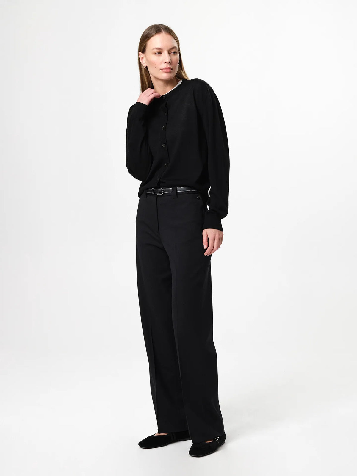 Lilja Merino Cardigan in black, crafted from 100% fine merino wool with a regular fit, round neckline, ribbed hem and lightweight knit quality designed for layering.