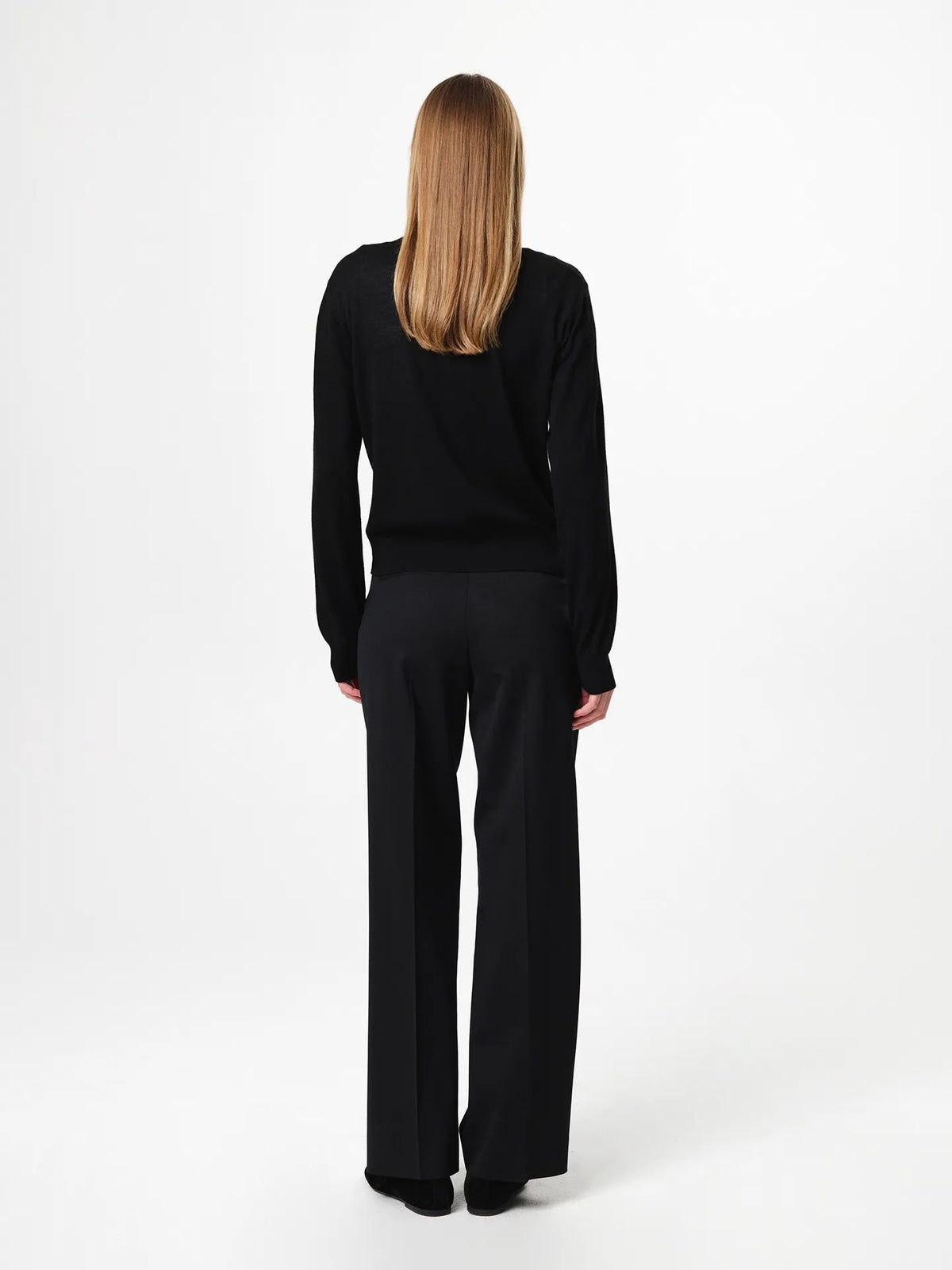 Lilja Merino Cardigan in black, crafted from 100% fine merino wool with a regular fit, round neckline, ribbed hem and lightweight knit quality designed for layering.