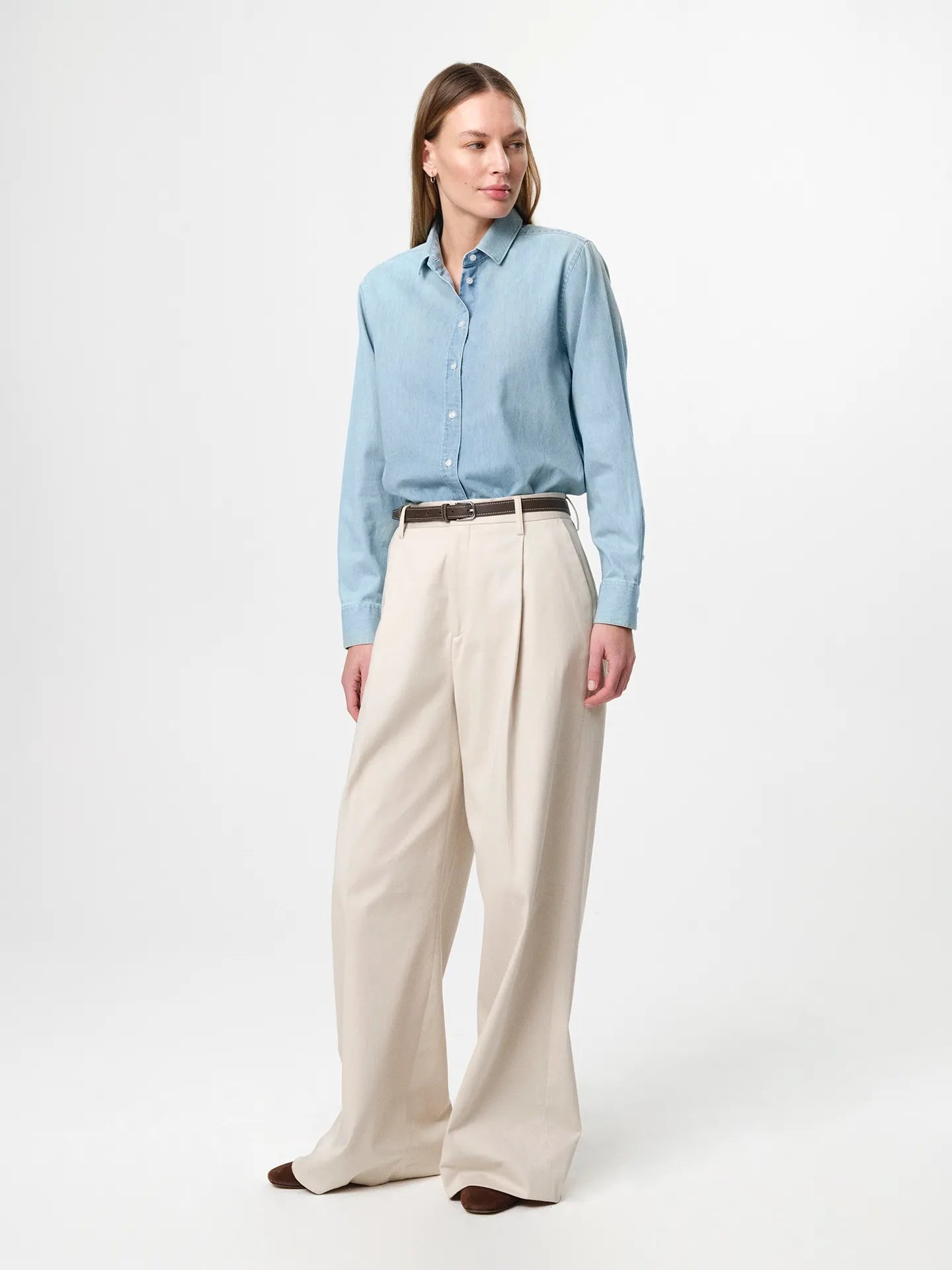 Julie Josephine Liv Light Denim Shirt: classic light denim shirt made from 100% cotton denim, designed with a fitted shoulder and a clean straight fit for an easy structured silhouette, styled for an elevated everyday look when paired with tailored trousers and a belt or worn casually over a tee.