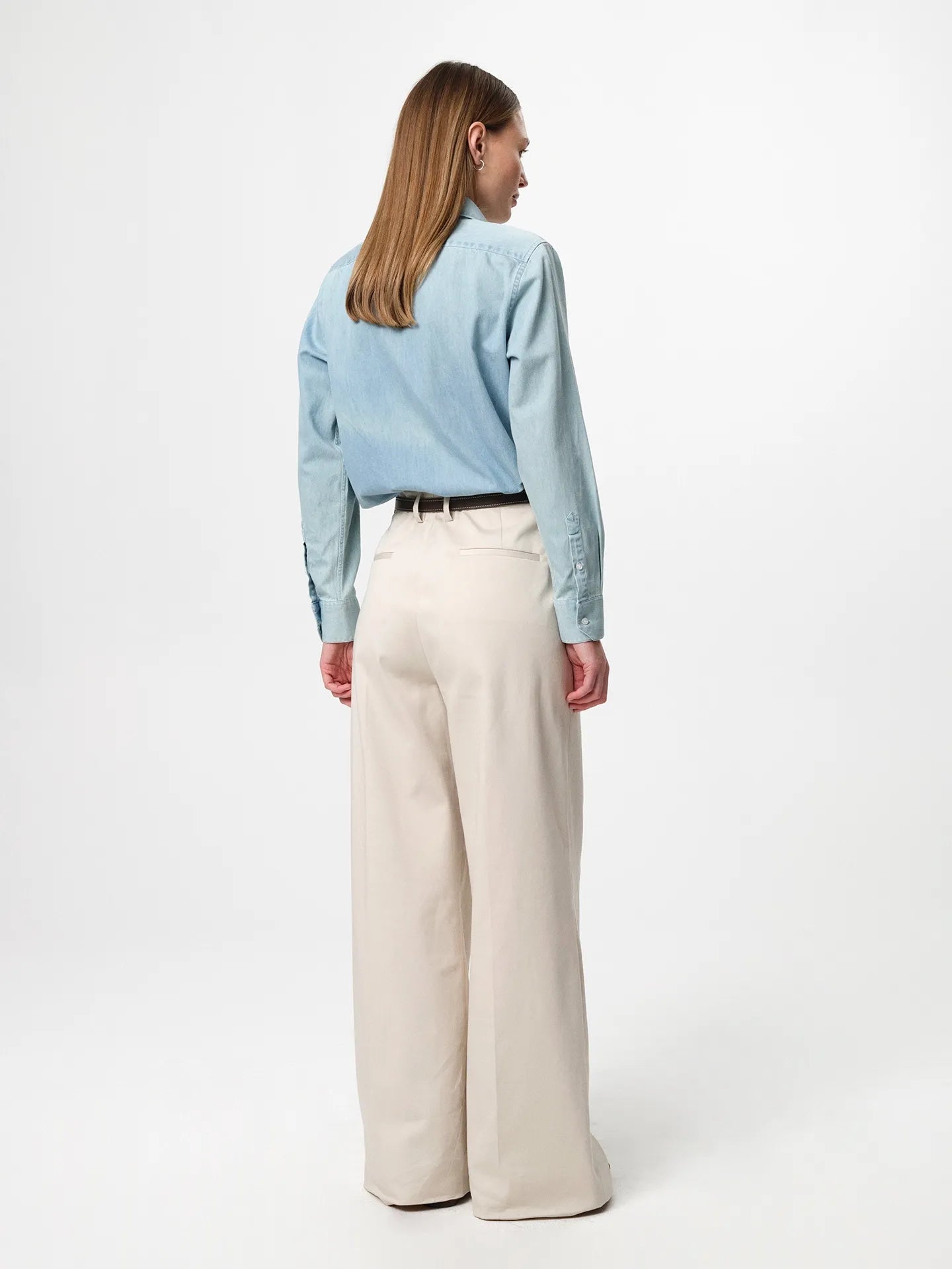 Julie Josephine Liv Light Denim Shirt: classic light denim shirt made from 100% cotton denim, designed with a fitted shoulder and a clean straight fit for an easy structured silhouette, styled for an elevated everyday look when paired with tailored trousers and a belt or worn casually over a tee.