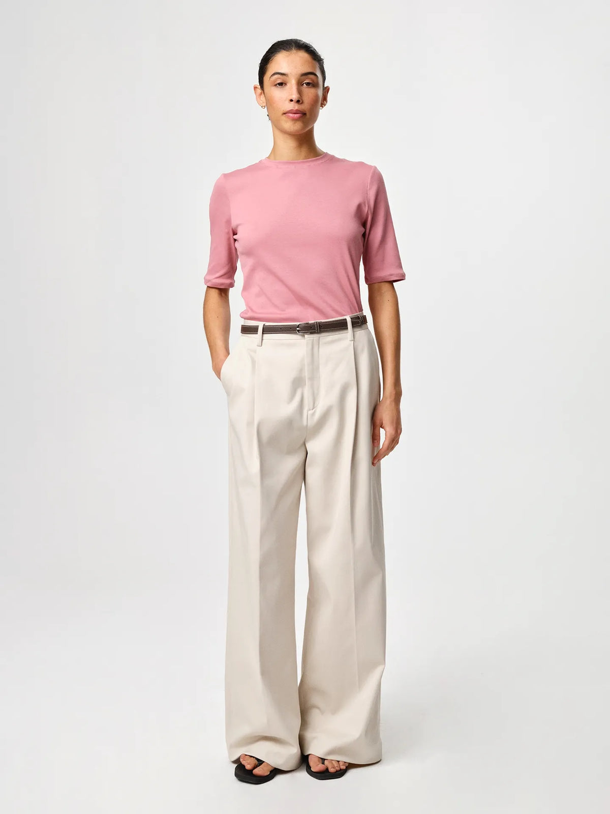 Julie Josephine Marianne Rib Tee Rosy Pink: capsule wardrobe rib tee in rosy pink made from 94% Italian pima cotton and 6% polyamide, crafted in soft structured Italian cotton rib jersey with a slim flattering fit, classic round neckline and elbow length sleeves that balance comfort and shape, designed for effortless versatility worn on its own or layered under shirts, knits, and blazers.