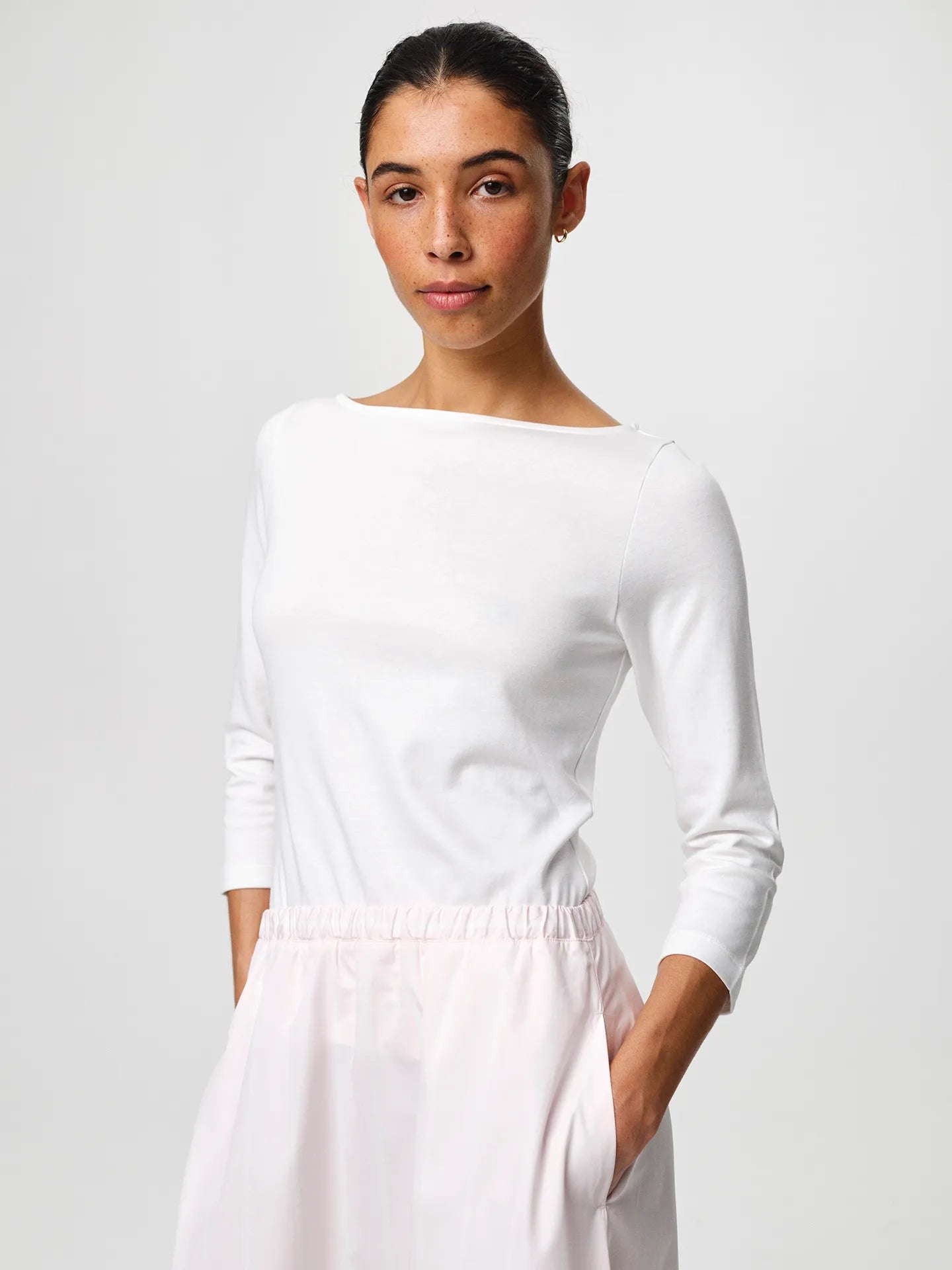 Julie Josephine Nina Half Sleeve White: fitted white half sleeve top made from a 94% Italian pima cotton and 6% polyamide blend, crafted in a smooth stretchy jersey for a soft supportive feel, designed as a versatile wardrobe essential to wear on its own or as a clean layering base under shirts, blazers, and knitwear.