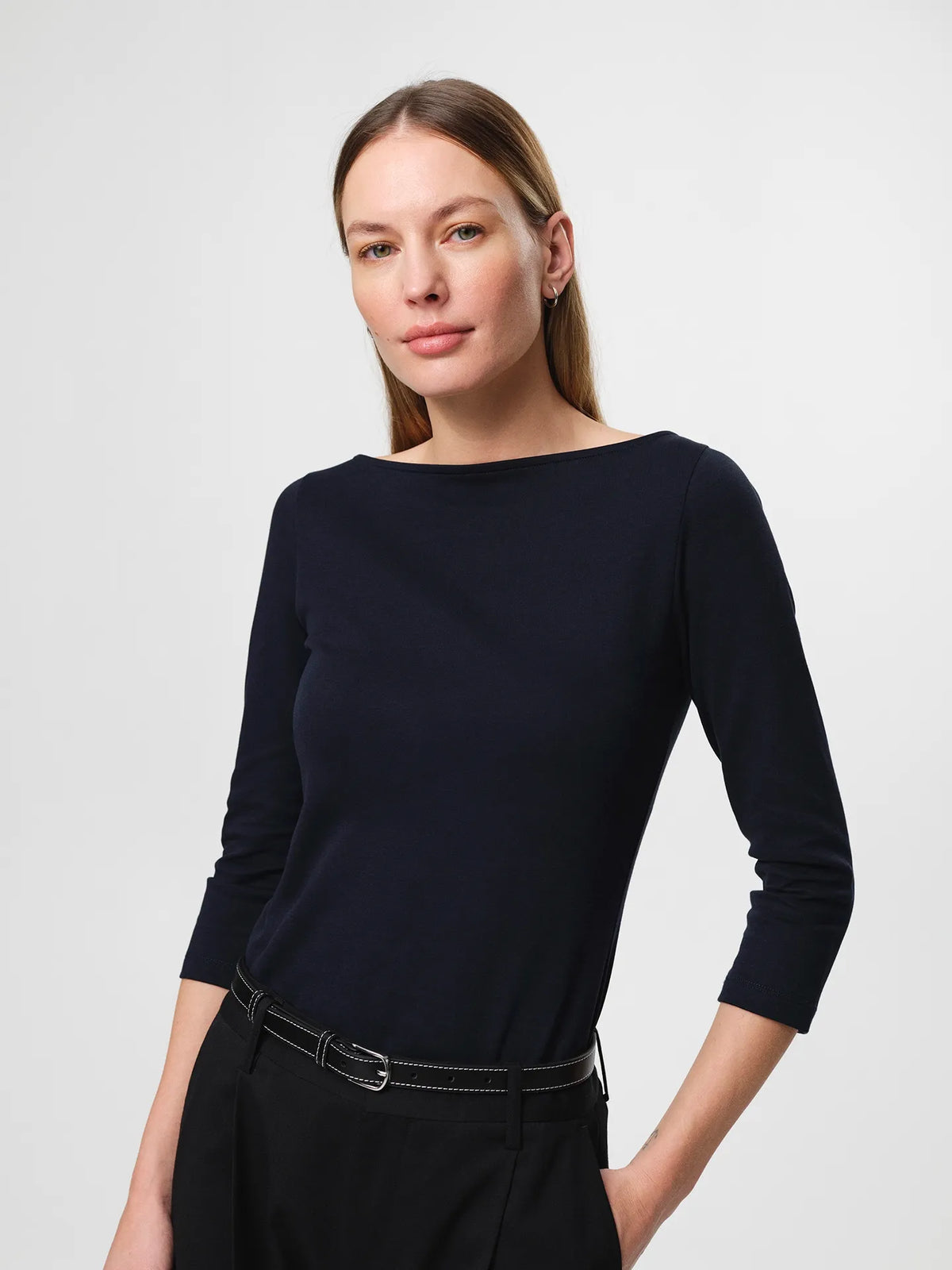 Julie Josephine Nina Half Sleeve Dark Navy: fitted half sleeve top in dark navy made from a 94% Italian pima cotton and 6% polyamide blend, crafted in a smooth stretchy jersey for a soft supportive feel, designed as a versatile wardrobe essential to wear on its own or as an easy layering base under shirts, blazers, and knitwear.