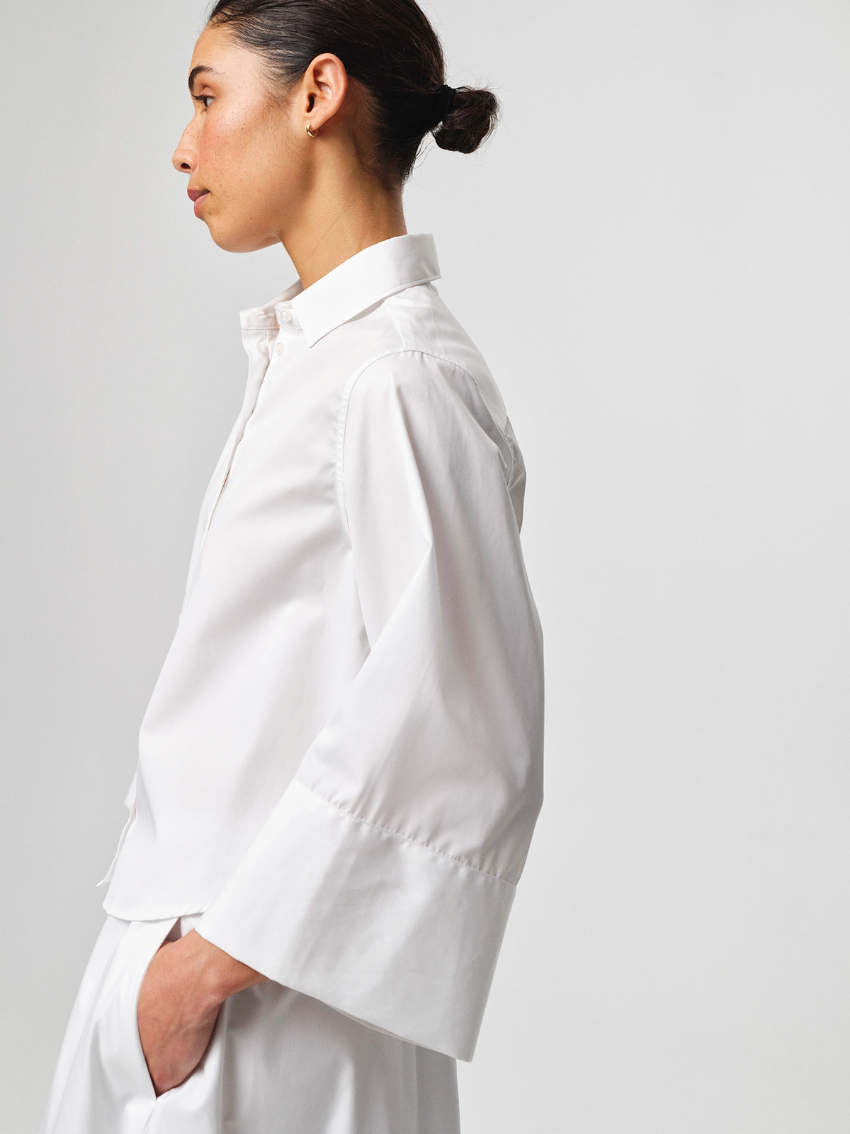 Julie Josephine Anja Shirt White: crisp white shirt made from 100% cotton with a clean classic silhouette, designed as a versatile wardrobe staple that works polished on its own or layered under knitwear and outerwear for effortless everyday styling.