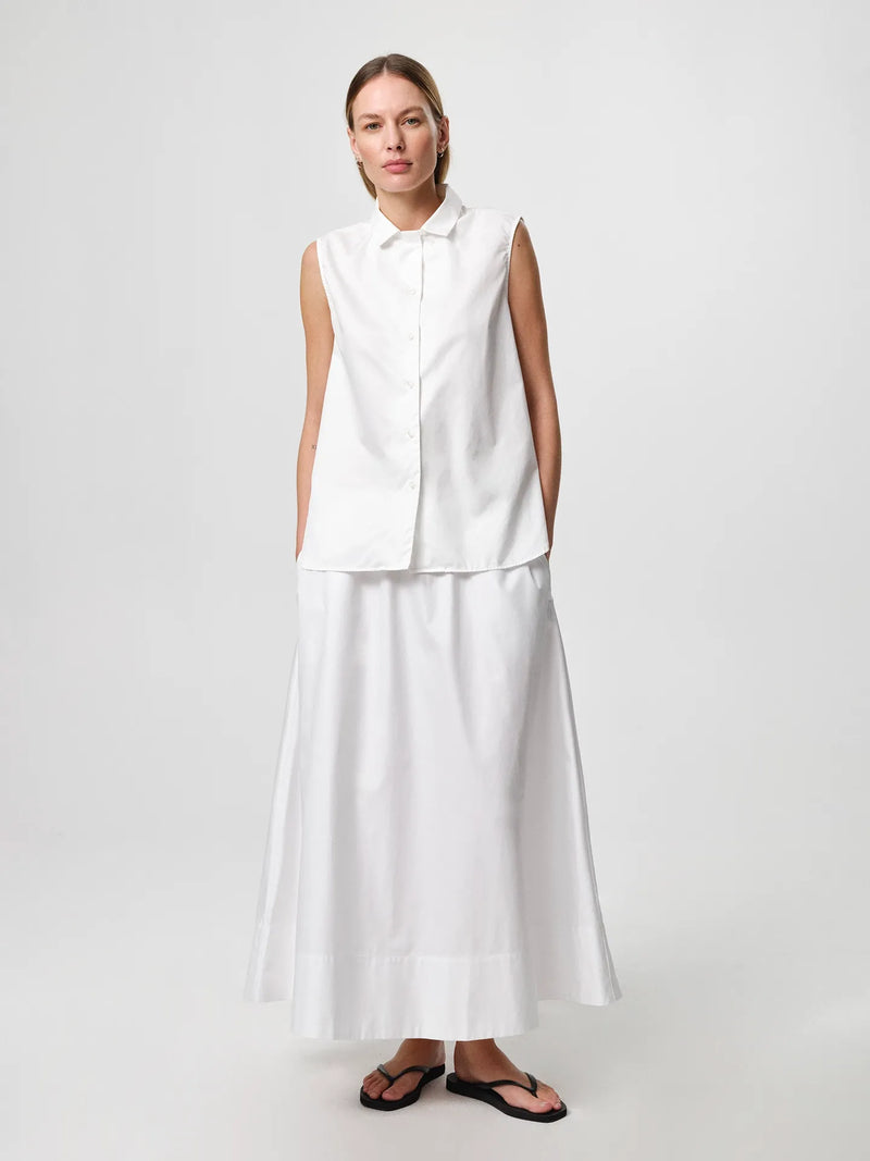 Sol Shirt in white, crafted from crisp cotton twill with an oversized fit, classic collar and gently curved hem.