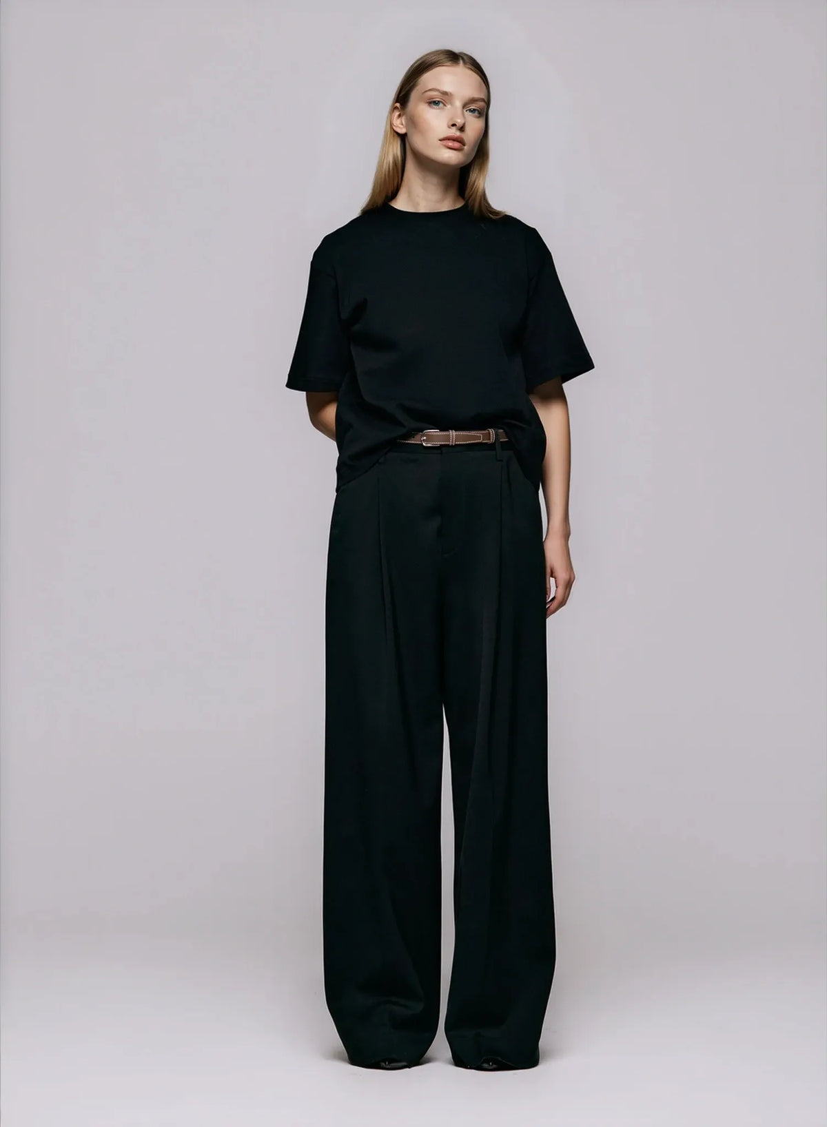 The Stella Tee in black by Julie Josephine, featuring a clean crew neckline, soft cotton texture, and a modern, oversized fit for timeless everyday wear