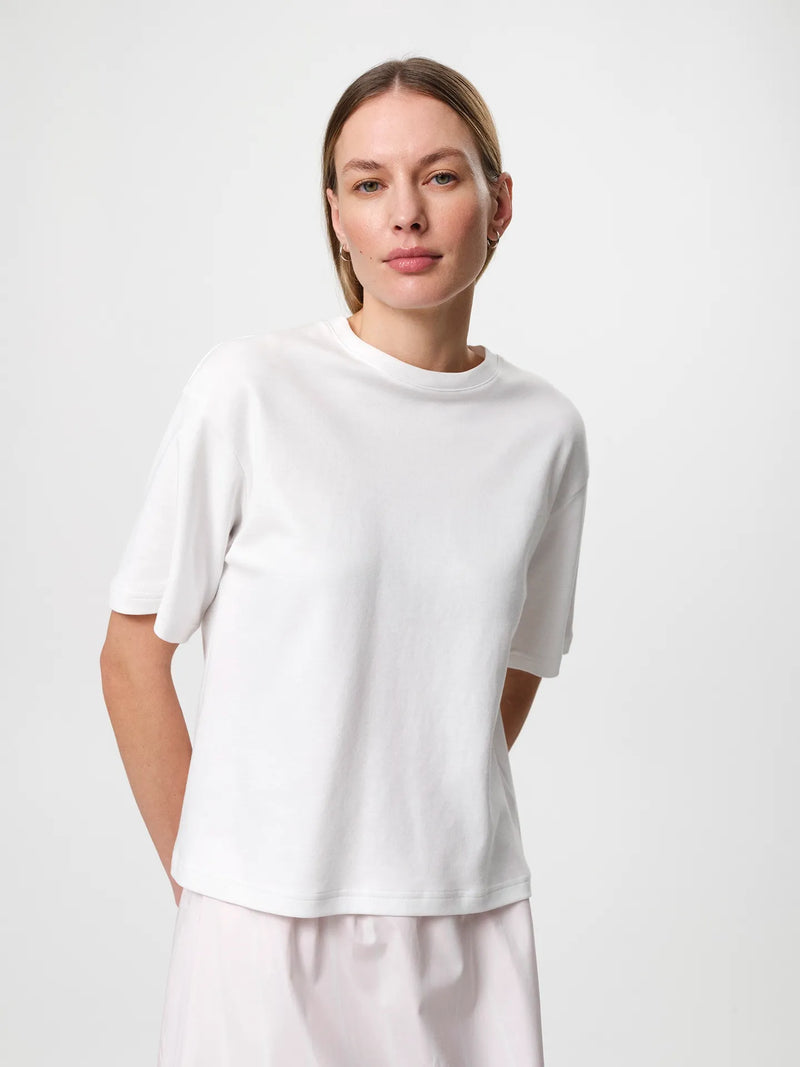 Stella T-shirt in white, crafted from soft organic cotton jersey with a classic crew neckline and relaxed fit.
