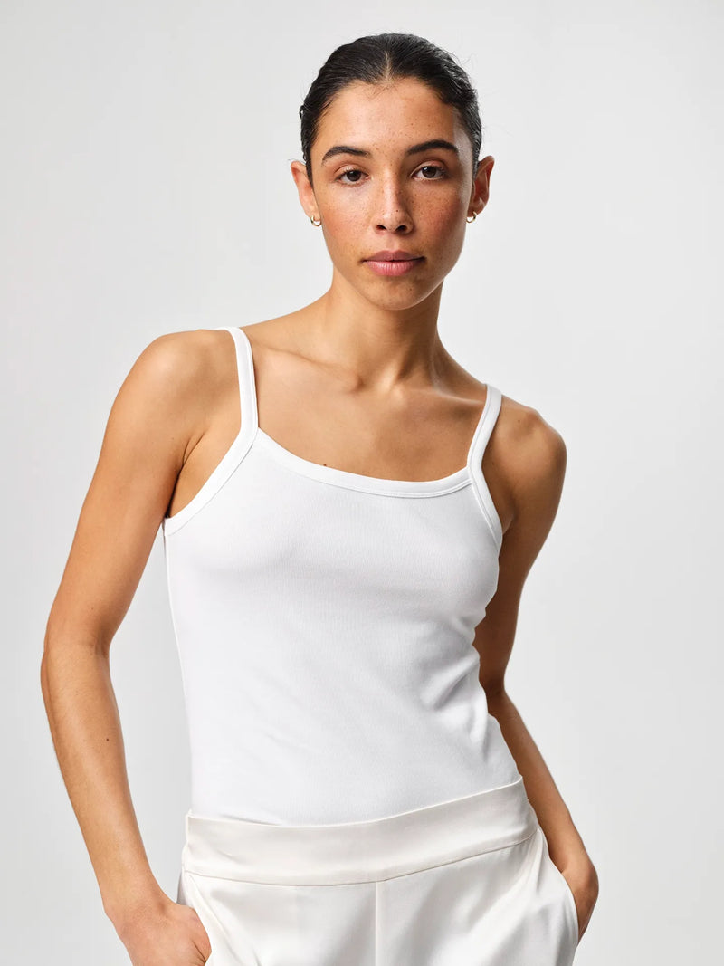 Tinki Rib Top in white, crafted from Italian Pima cotton-blend rib jersey with a slim fit and clean sleeveless silhouette.